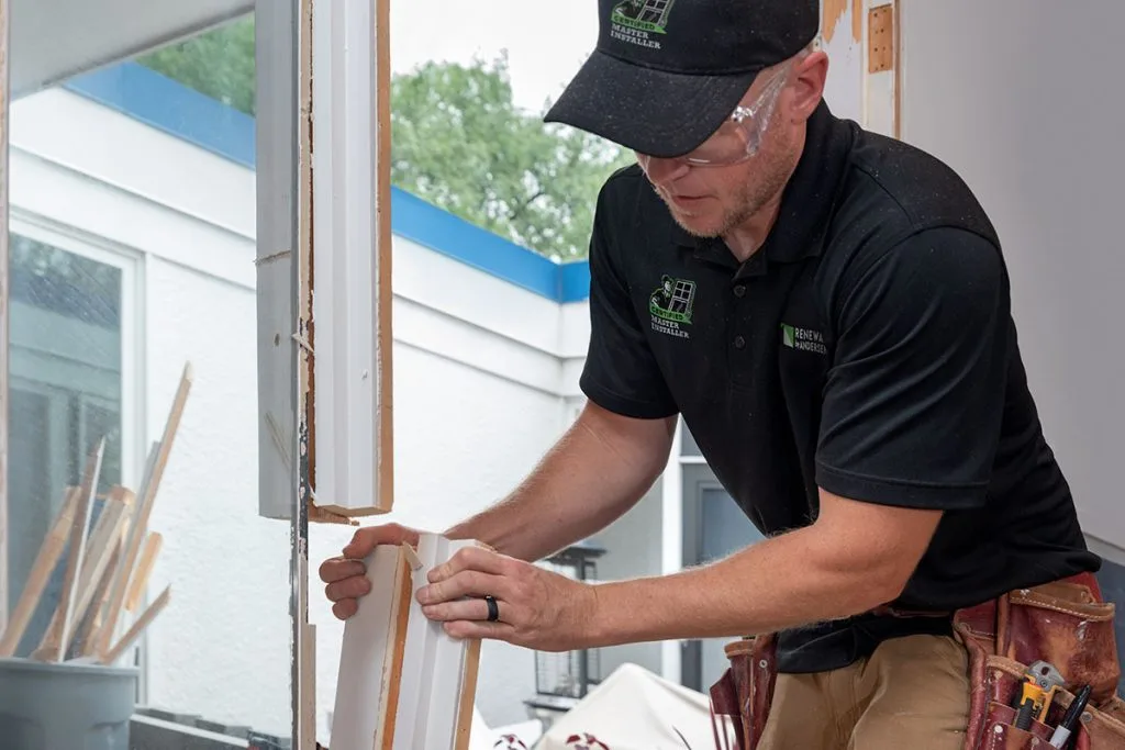 Master Installers talking down old window to install Acclaim replacement windows.